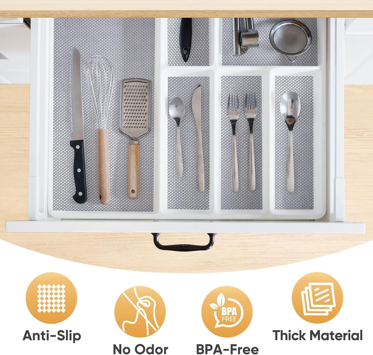 Non-slip cabinet liner lining a shelf under dishes