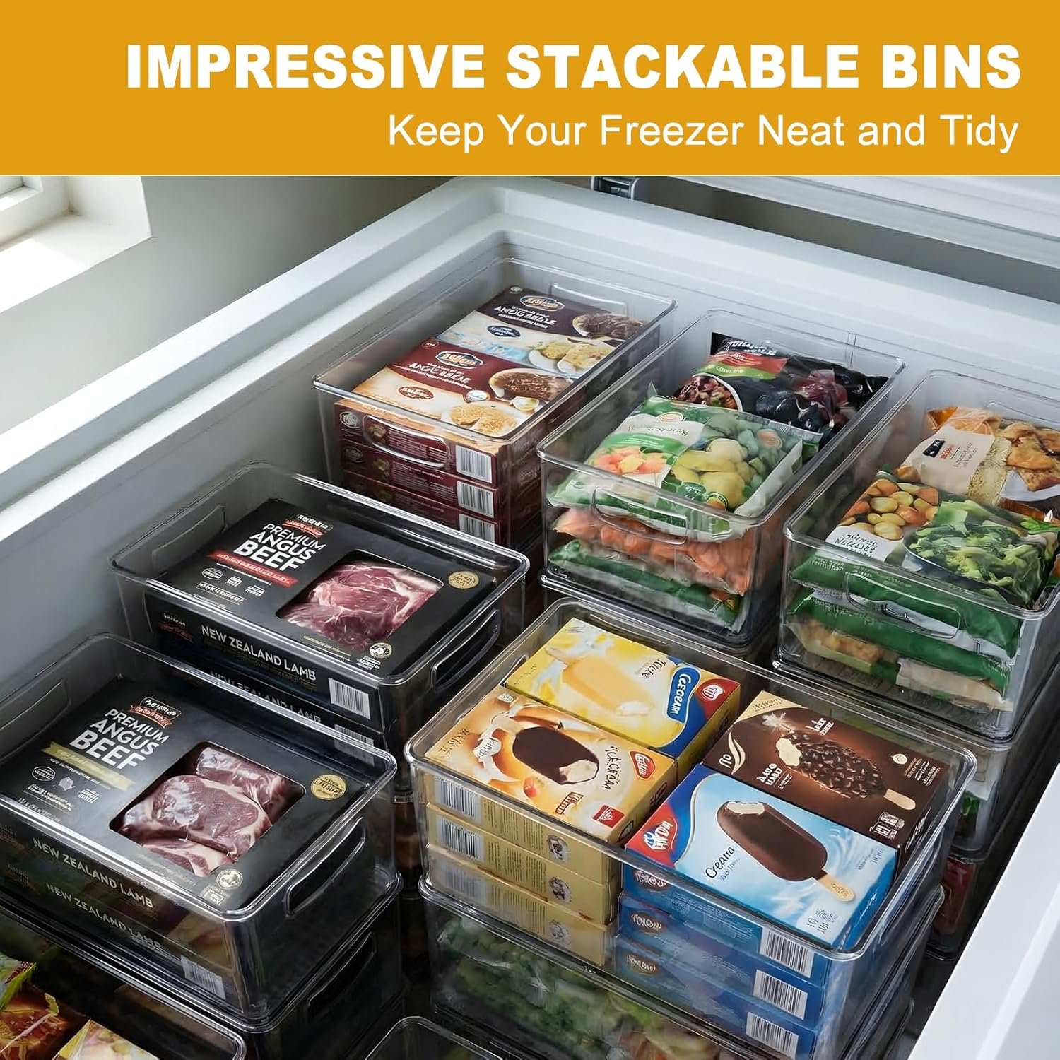 Freezer organizer bins holding bags and containers upright inside a freezer